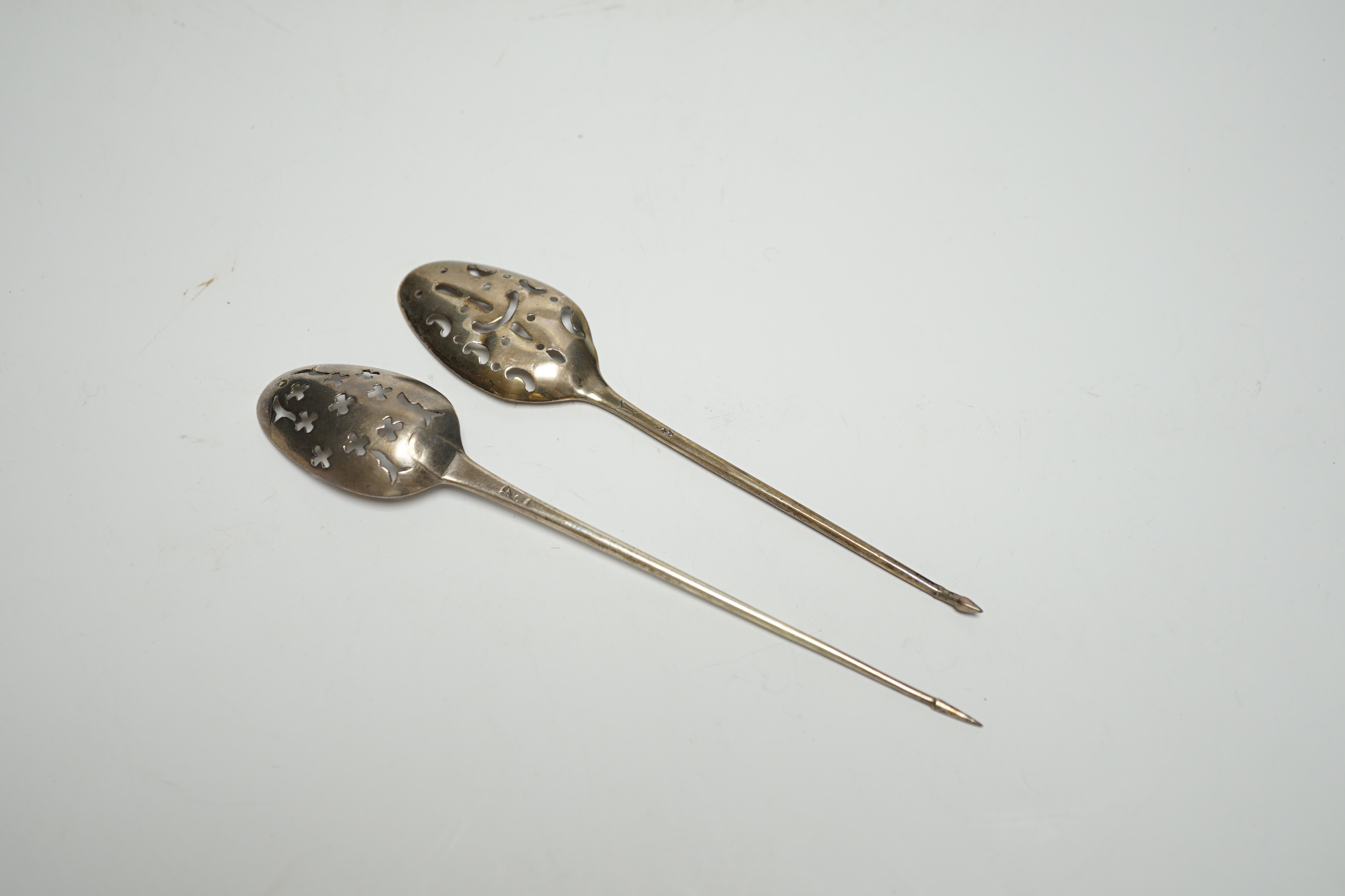 Two Georgian silver mote spoons, 14.1cm.